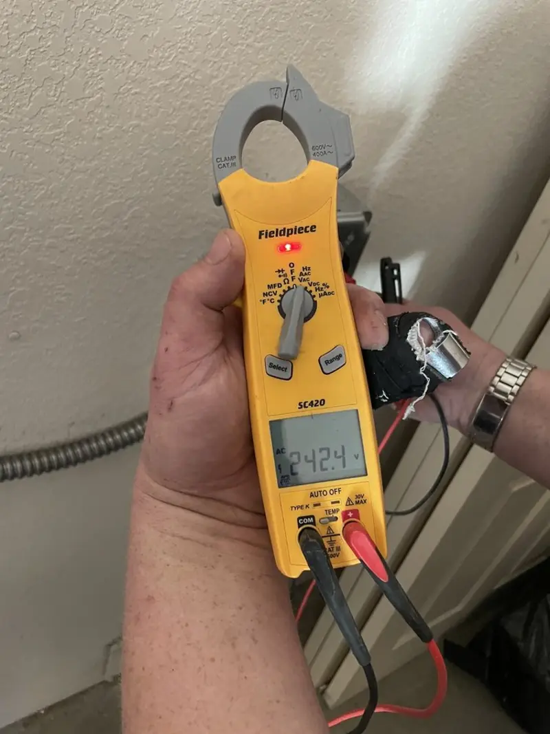 Voltage testing with clamp meter during Outlet Installation in Essex